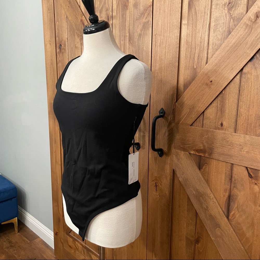 Brand new double lined black tank bodysuit